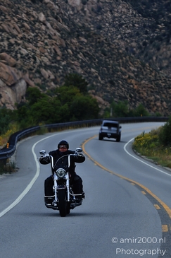 Man_riding_motorcycle_on_mountain_road_in_Colorado_Transportation_Collection_USA_Highway_and_Road_Scenes_Photography_Canon_EOS_R5_Mark_II_2025_002.JPG