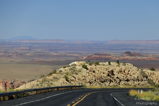 On The Way In Western USA in Transportation Collection. A lone highway cuts through the rugged - image from year 2025 #032