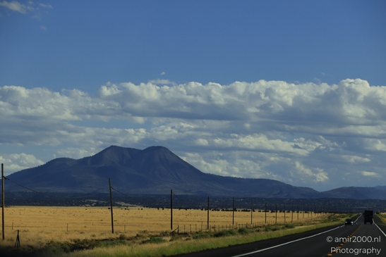 On The Way In Western USA in Transportation Collection. A two-lane highway stretches towards - image from year 2025 #043