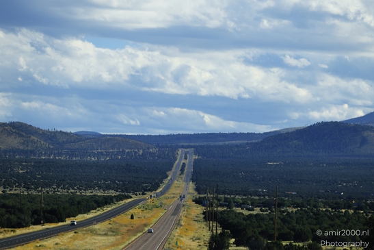 On The Way In Western USA in Transportation Collection. A long, straight highway cuts through - image from year 2025 #046