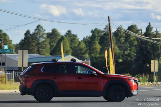 On The Way In Western USA in Transportation Collection. A red SUV on a road in the western USA. - image from year 2025 #048