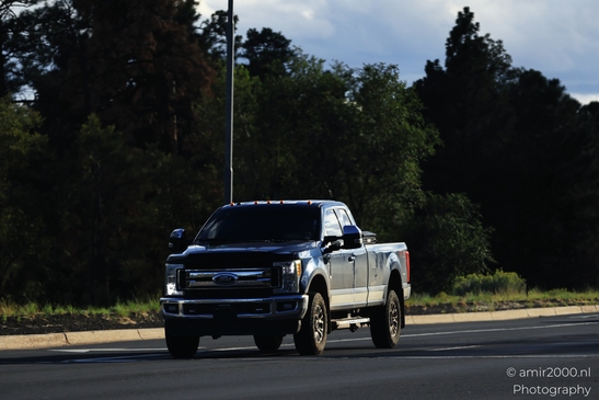 On The Way In Western USA in Transportation Collection. A silver truck driving on a highway in - image from year 2025 #049