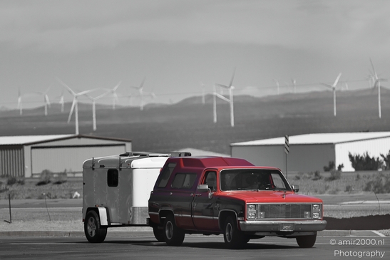 On The Way In Western USA in Transportation Collection. A red truck towing a camper on the road - image from year 2025 #025