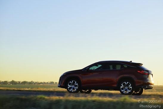Red SUV driving on road around Denver Colorado A red car with blurred background on a highway image from year 2025 #2
