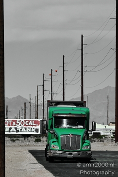 Trucks In Western USA in Transportation Collection. A green semi-truck parked at a gas station - image from year 2025 #006