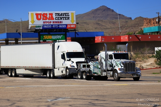 Trucks In Western USA in Transportation Collection. Two semi-trucks parked at a gas station in - image from year 2025 #010