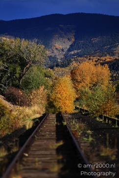 A picturesque scene of fall foliage alongside a deserted train route in the Western USA. image from year 2025 #10