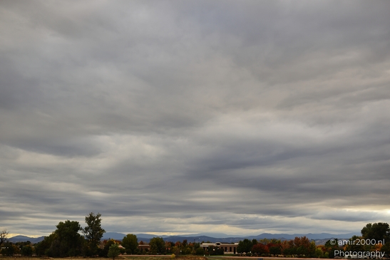 Cloudy_Sky_Over_A_Cityscape_On_The_Way_Colorado_USA_Western_USA_Nature_Photography_Canon_EOS_R5_Mark_II_2025_003.JPG