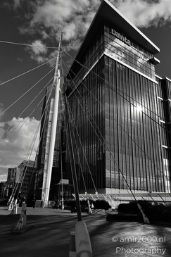 A modern skyscraper with a reflective glass facade in Denver Colorado USA. - image from year 2025 #005