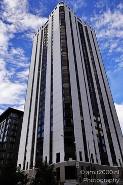 A tall modern office building with reflective glass facade in Denver. - image from year 2025 #004