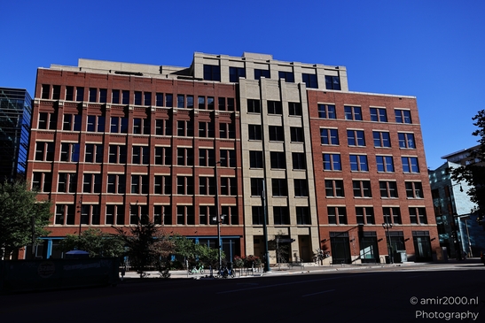 A large red brick and concrete office complex in Denver Colorado USA. - image from year 2025 #010