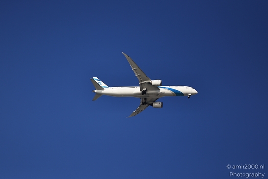 An El Al Israel Airlines Boeing 787 Dreamliner in flight against a clear blue sky. - image from year 2025 #001