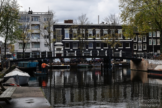 Dutch_Canal_Scene_With_Boats_And_Buildings_Amsterdam_Netherlands_cityscape_Photography_Canon_EOS_R5_Mark_II_2025_001.JPG