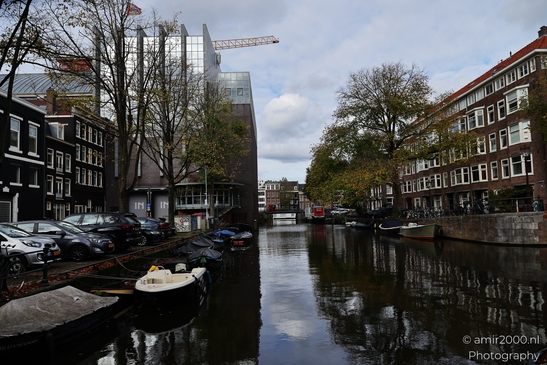 Dutch_Canal_Scene_With_Boats_And_Buildings_Amsterdam_Netherlands_cityscape_Photography_Canon_EOS_R5_Mark_II_2025_002.JPG