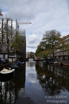 Dutch_Canal_Scene_With_Boats_And_Buildings_Amsterdam_Netherlands_cityscape_Photography_Canon_EOS_R5_Mark_II_2025_003.JPG