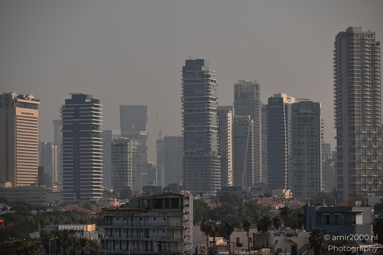 Urban_Skyline_With_Tall_Buildings_And_Hazy_Atmosphere_Tel_Aviv_jaffa_Israel_cityscape_Photography_Canon_EOS_R5_Mark_II_2025_001.JPG