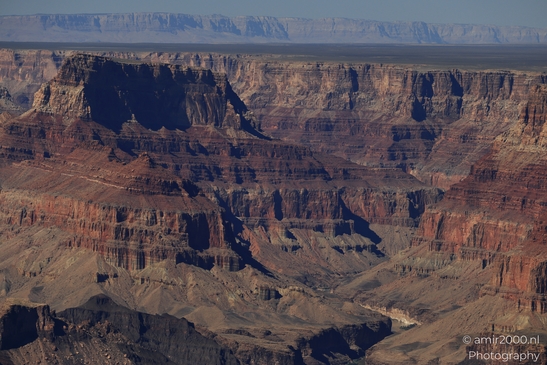 Lipan Point overlook wide Colorado River views cutting through layered canyon walls under clear - image from year 2025 #011