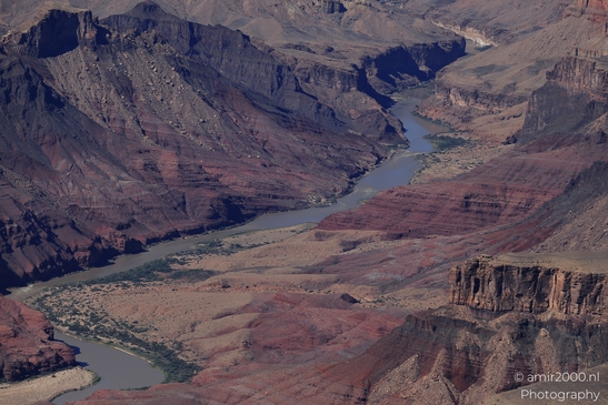 Lipan Point overlook wide Colorado River views cutting through layered canyon walls under clear - image from year 2025 #013