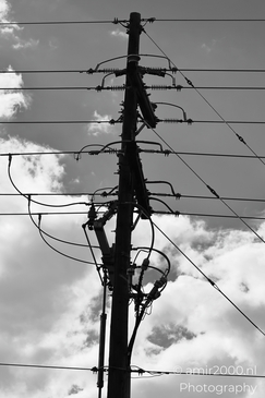 Power lines against cloudy sky Colorado Springs in Utility Photography Series. Powering the - image from year 2025 #001