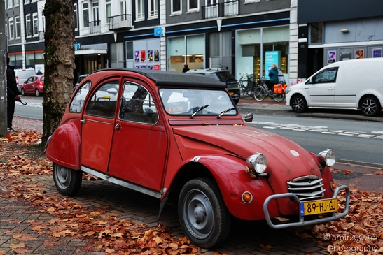 Red_Classic_Car_On_Urban_Street_With_Autumn_Leaves_In_Amsterdam_Car_Automobile_Photography_miscellaneous_Photography_Canon_EOS_R5_Mark_II_2025_001.JPG