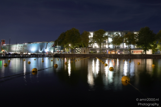 Night view of Marineterrein in Amsterdam, Netherlands with illuminated buildings and trees - image from year 2025 #003