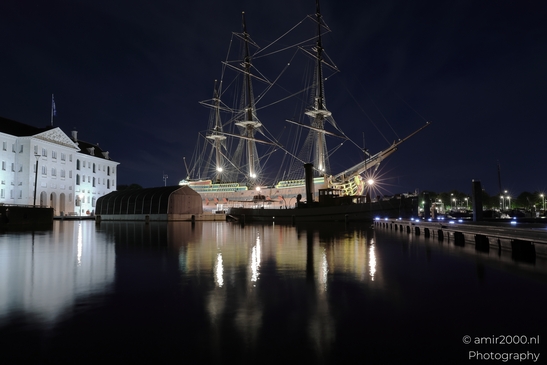 The VOC ship Amsterdam replica is docked at night in Amsterdam, Netherlands, with lights - image from year 2025 #004