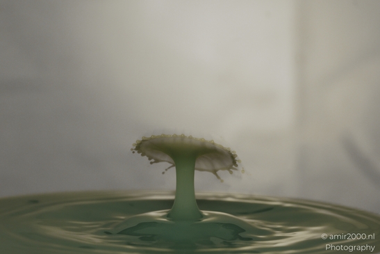 Water drops creatively collide in a yellow explosion of energy in Water Drops Creative Series. . - image from year 2025 #009