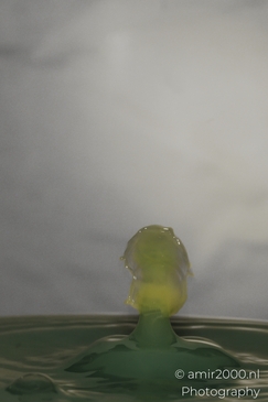 Water drops creatively collide in a vibrant yellow dance, captured in this artistic series in - image from year 2025 #012