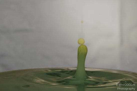 Water droplet dance in a creative series of yellow and green hues in Water Drops Creative - image from year 2025 #035