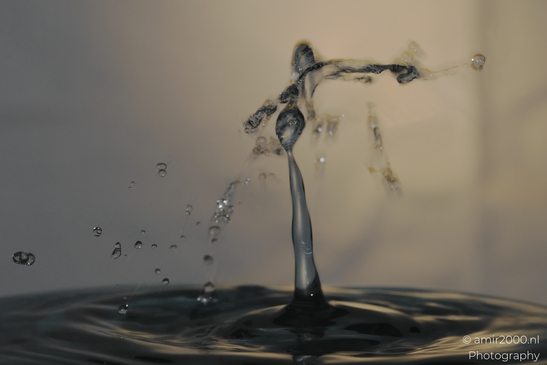 Water droplets in motion captured in a single frame, creating an artistic representation of - image from year 2025 #004