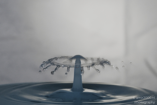 Water droplets captured in mid-air after a high speed collision, creating an artistic series of - image from year 2025 #011