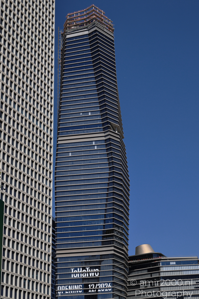ToHa 2 tower blue glass facade under construction in Tel Aviv-Jaffa with opening sign