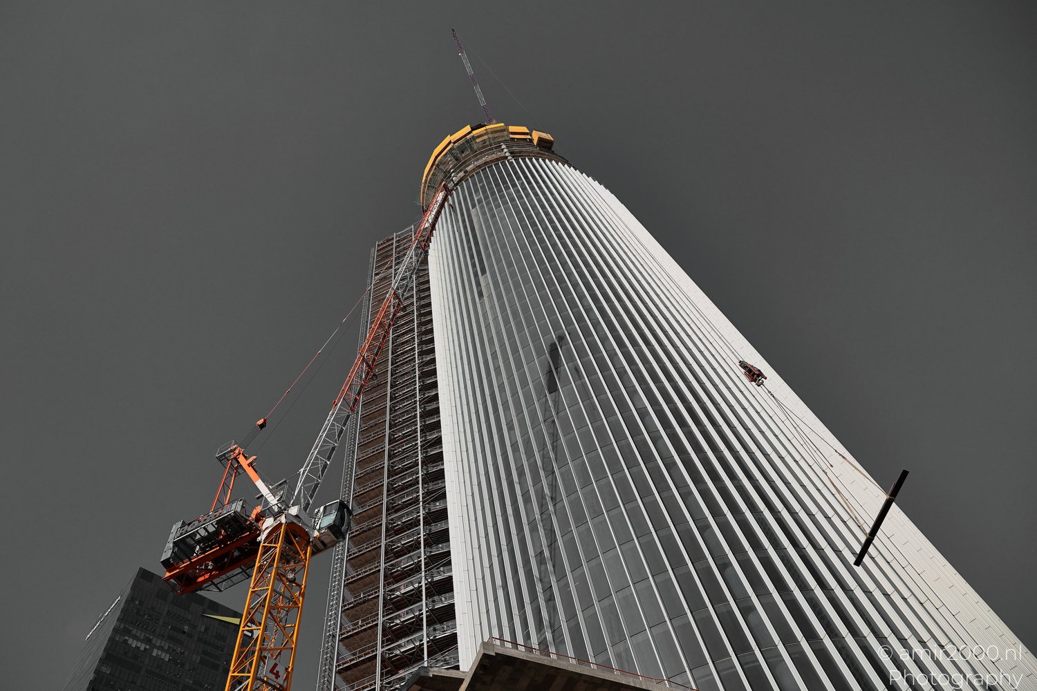 Azrieli Spiral Tower rising beside cranes and scaffolding in Tel Aviv-Jaffa