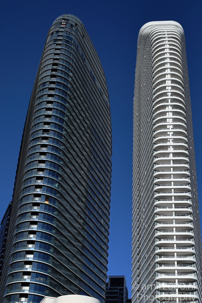Two residential skyscrapers rising against blue sky in Ramat Gan
