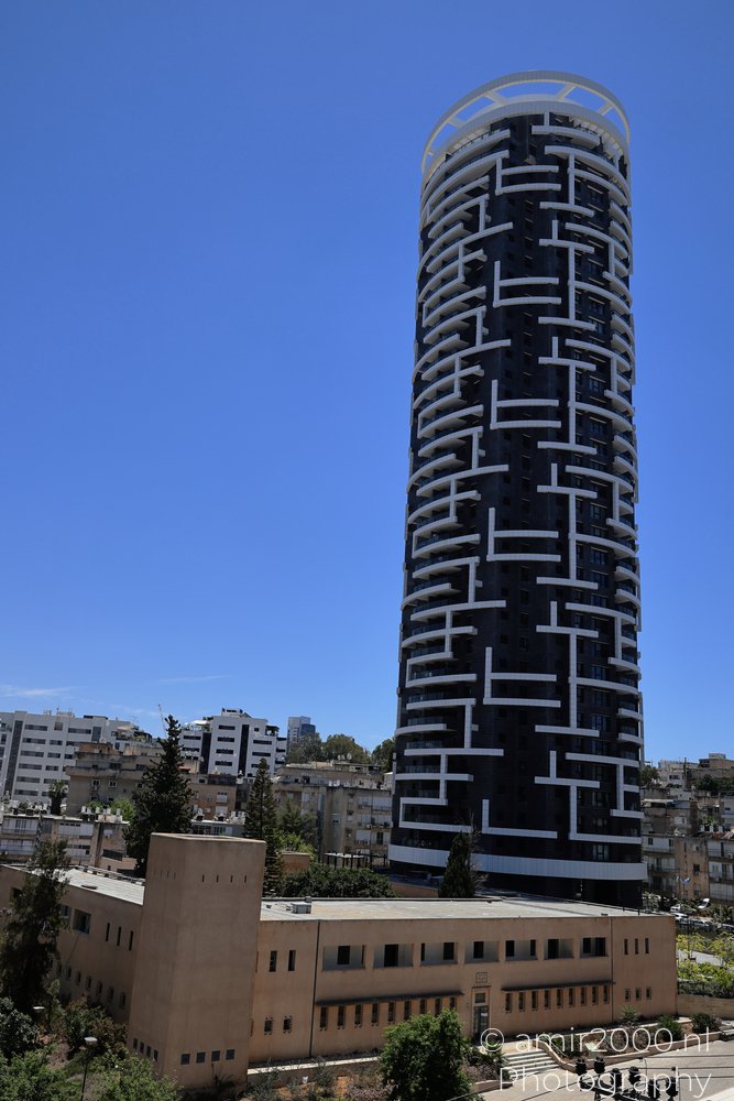 Metro Tower carrying white balcony bands around its facade in Ramat Gan, Israel