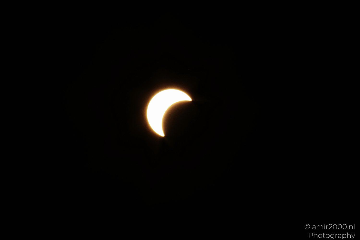 Moon covering the Sun during a partial solar eclipse in Amsterdam