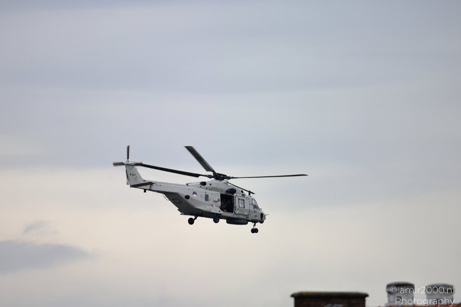 Royal Netherlands Navy NH90 NFH flying above Amsterdam rooftops