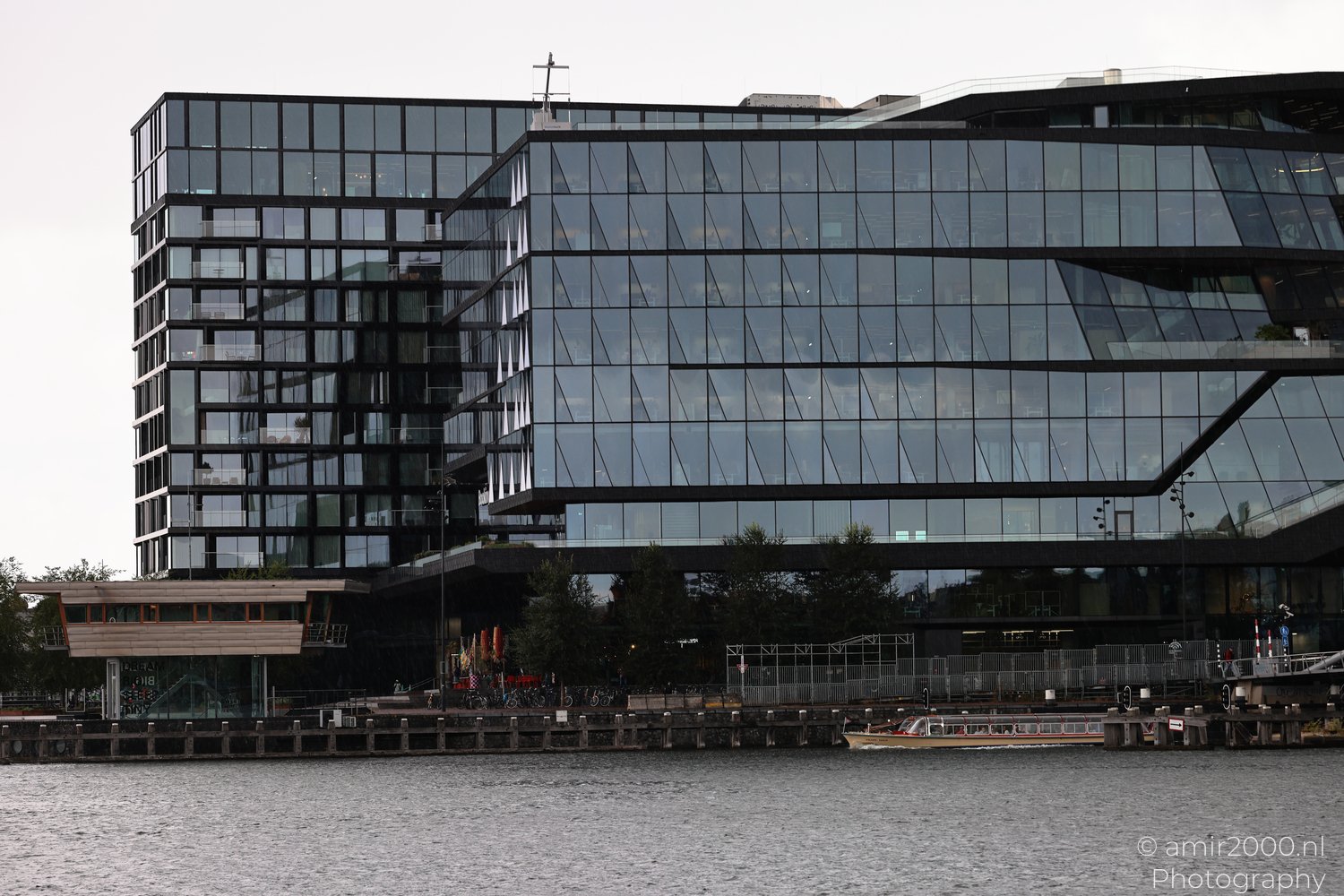 Booking Com Campus Offices shows structural lines, surfaces, and light in Amsterdam, Netherlands.