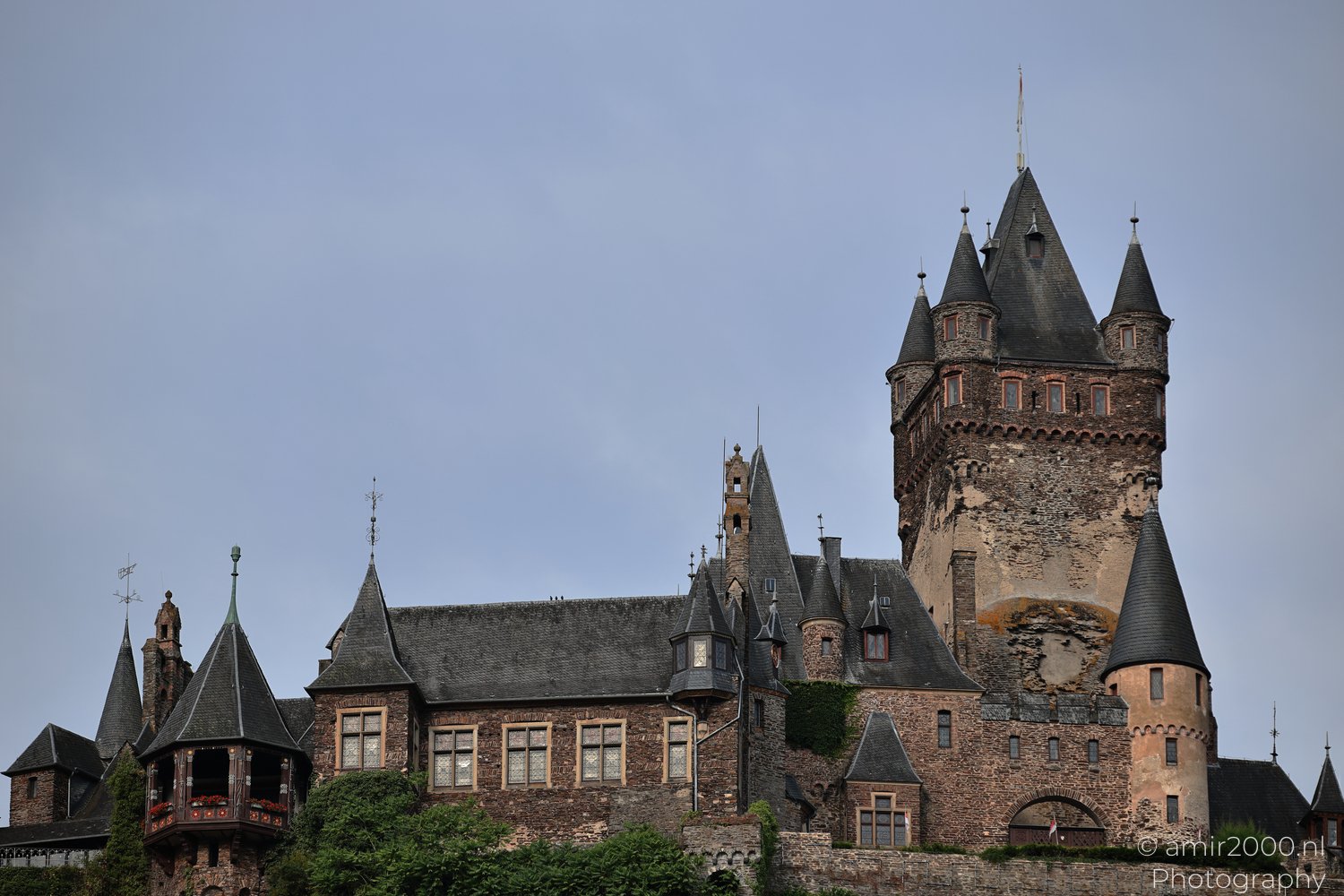 Close view of Reichsburg Cochem towers, roofs, and stone walls