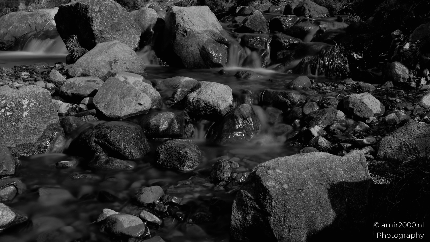 Fairy Pools stream flowing around rocks in Glen Brittle