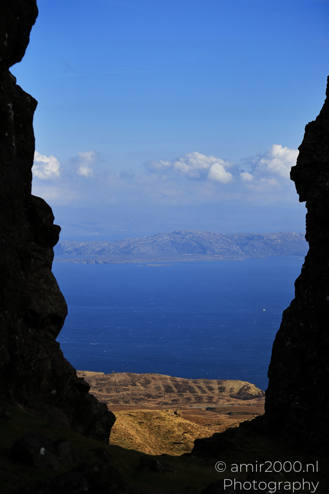 Sea view framed by Old Man of Storr rocks on Isle of Skye