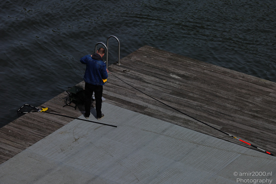 Fisherman_On_Dock_In_Amsterdam_Netherlands_People_Creative_Collection_Photography_Canon_EOS_R5_Mark_II_2026_001.JPG