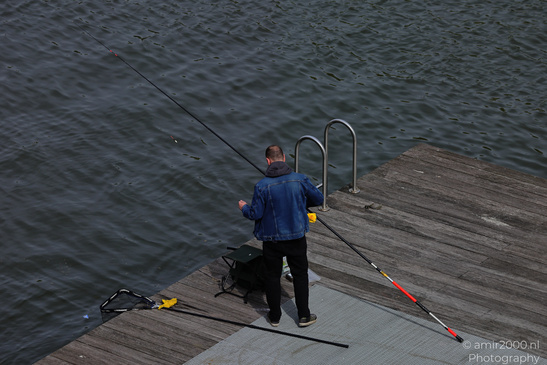 Fisherman_On_Dock_In_Amsterdam_Netherlands_People_Creative_Collection_Photography_Canon_EOS_R5_Mark_II_2026_002.JPG