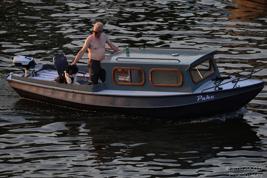 Man_And_Dog_On_Boat_Amsterdam_Netherlands_People_Creative_Collection_Photography_Canon_EOS_R5_Mark_II_2026_001.JPG