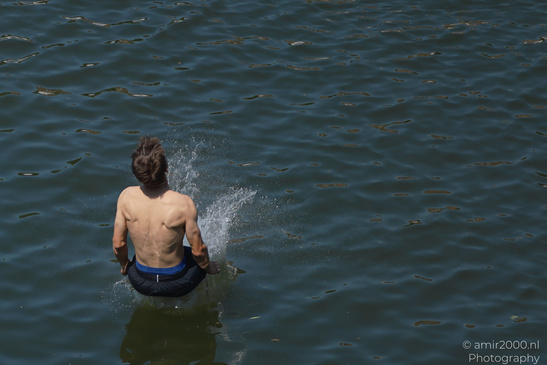 Man_Jumping_Into_Canal_Water_Amsterdam_Netherlands_People_Creative_Collection_Photography_Canon_EOS_R5_Mark_II_2026_001.JPG