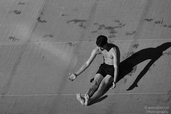 Man_On_Canal_Dock_In_Monochrome_Amsterdam_Netherlands_People_Creative_Collection_Photography_Canon_EOS_R5_Mark_II_2026_002.JPG
