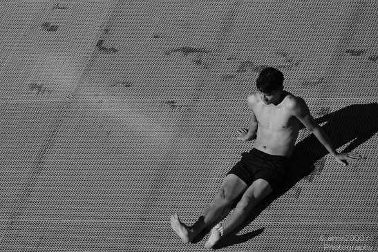 Man_On_Canal_Dock_In_Monochrome_Amsterdam_Netherlands_People_Creative_Collection_Photography_Canon_EOS_R5_Mark_II_2026_003.JPG