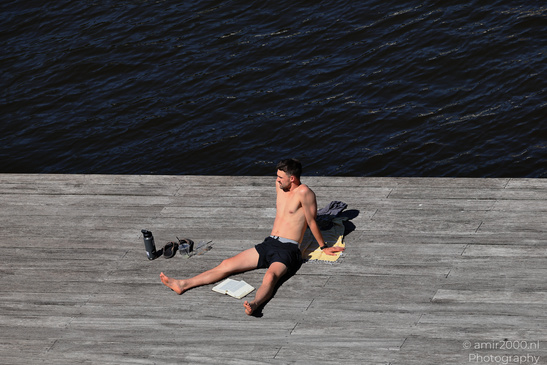 Man_Sunbathing_By_The_Canal_Amsterdam_Netherlands_People_Creative_Collection_Photography_Canon_EOS_R5_Mark_II_2026_001.JPG