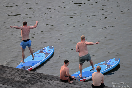 Men includes rippled water, surface reflections, and calm light in Amsterdam, Netherlands. image from year 2026 #8