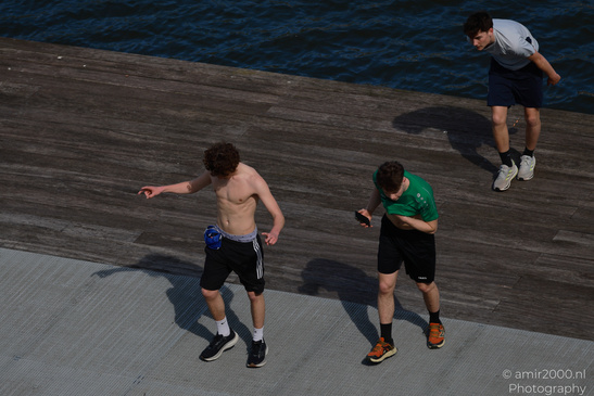 Men_Playing_On_The_Dock_Amsterdam_Netherlands_People_Creative_Collection_Photography_Canon_EOS_R5_Mark_II_2026_001.JPG